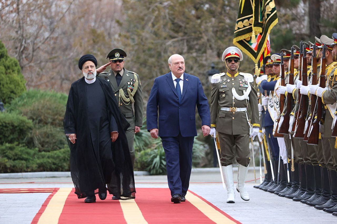 Iranian President Ebrahim Raisi, left,  walks with Belarus President Alexander?Lukashenko?during a welcoming ceremony in Tehran, Iran, on March 13.