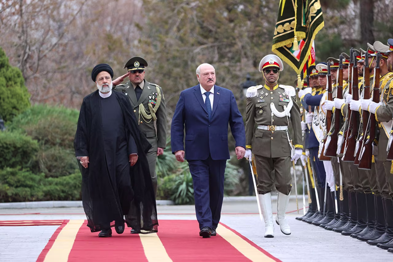 Iranian President Ebrahim Raisi, left,  walks with Belarus President Alexander Lukashenko during a welcoming ceremony in Tehran, Iran, on March 13.