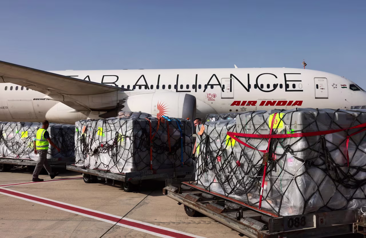 Workers load medical aid to be flown to India at Israel's Ben Gurion Airport near Tel Aviv on May 4.