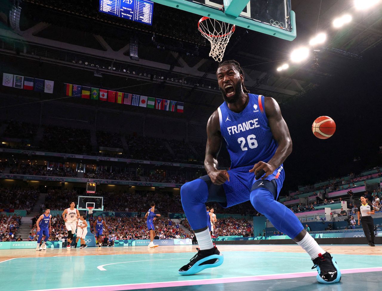 Mathias Lessort of France celebrates after scoring a basket against Japan on Tuesday.