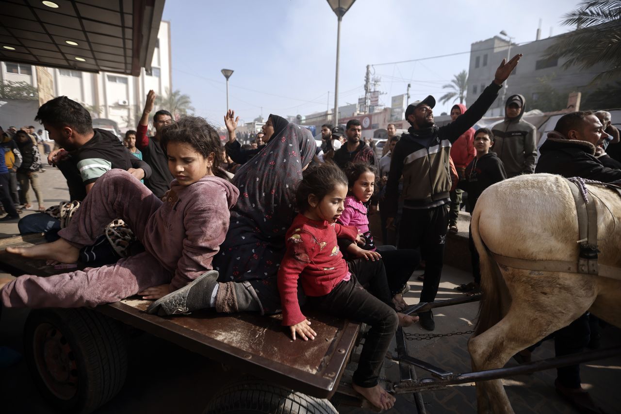 Palestinians wounded during the Israeli bombardment of the Gaza Strip are brought over a donkey carte to the Nasser hospital in Khan Younis, Southern Gaza, on January 22.