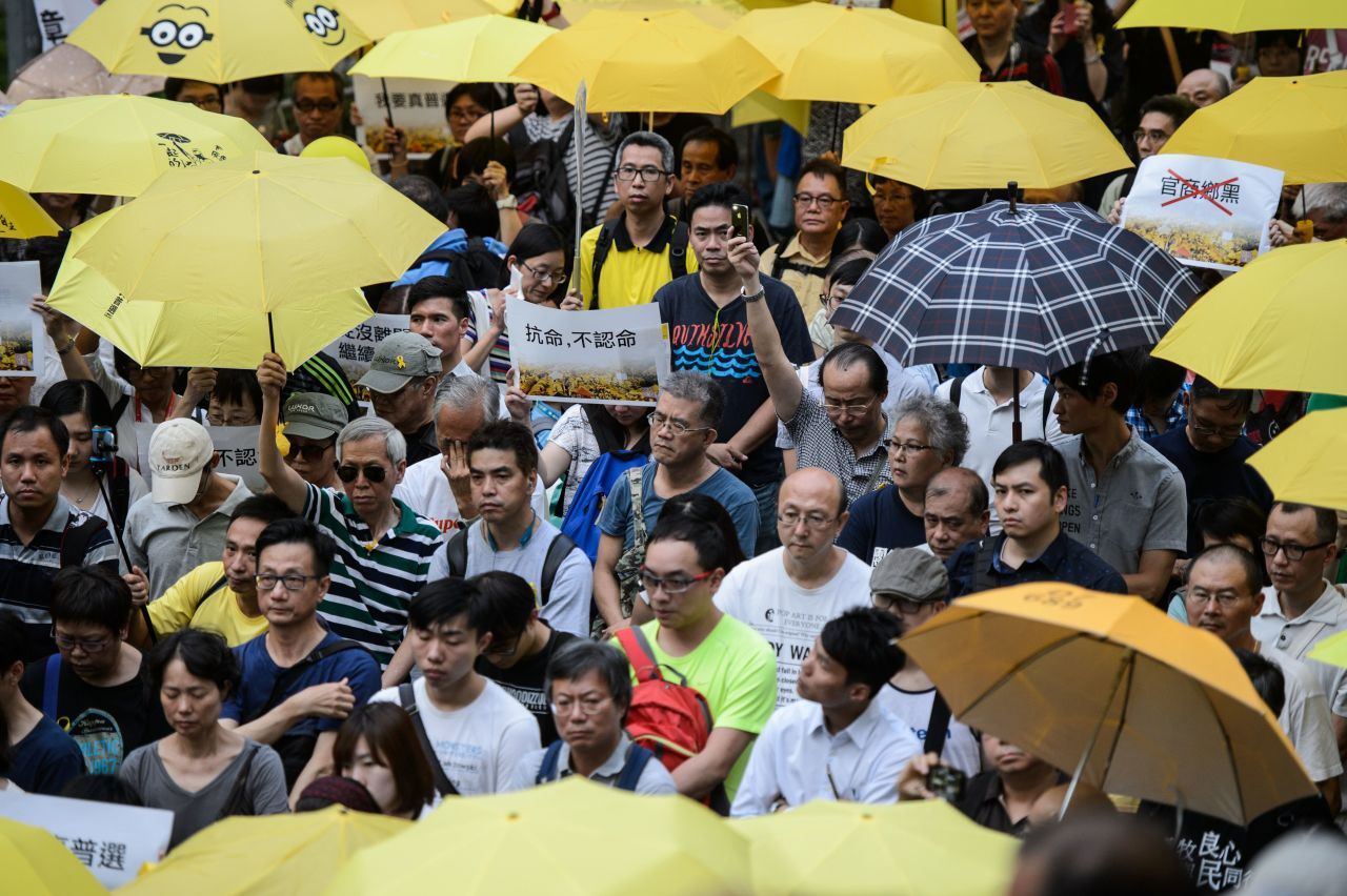 Activists in 2016 holding yellow umbrellas, a symbol of the pro-democracy movement after 2014's Umbrella Revolution.