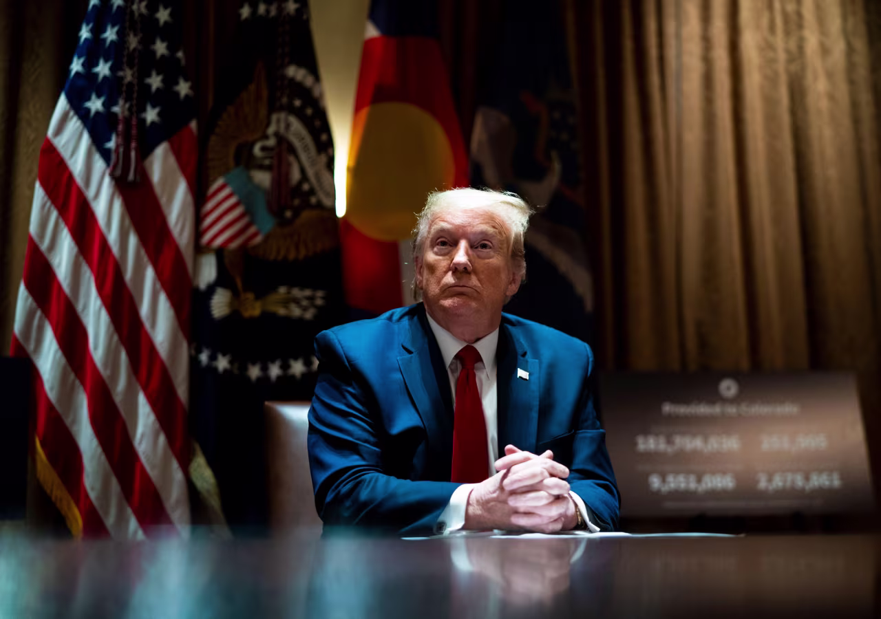 President Donald Trump looks on he as meets with Colorado Governor Jared Polis and North Dakota Governor Doug Burgum in the Cabinet Room of the White House on May 13.