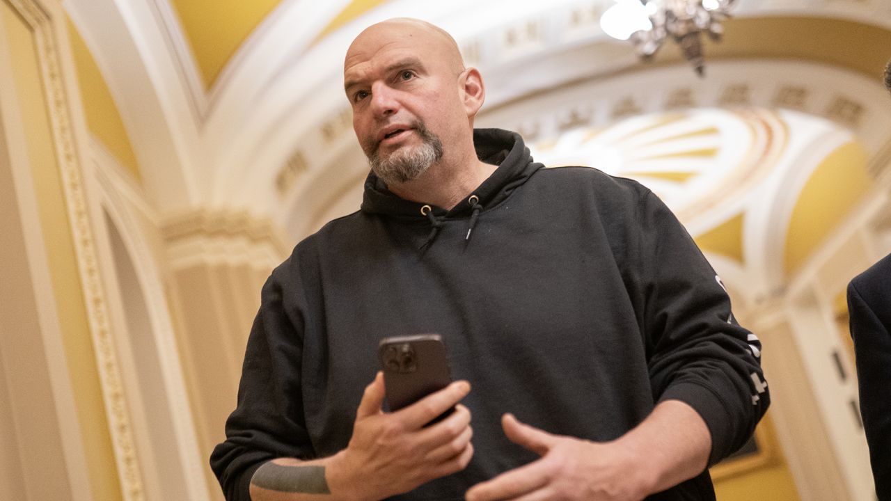 U.S. Sen. John Fetterman (D-PA) on March 23 walking toward the Senate Chambers in Washington, DC. 