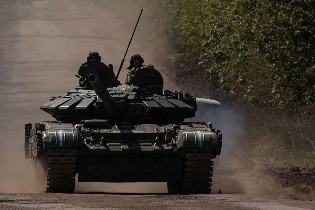 Ukrainian servicemen ride atop a tank on a road to the frontline town of?Bakhmut, Ukraine, on May 12. 