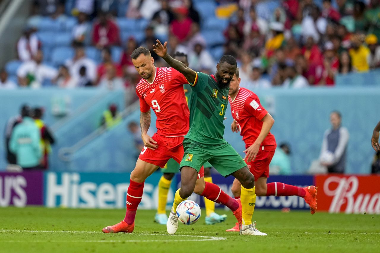 Haris Seferovic (Switzerland) and Nicolas N'Koulou (Cameroon) battle for the ball during the FIFA World Cup Qatar 2022 Group G match between Switzerland and Cameroon at Al Janoub Stadium on November 24, in Al Wakrah, Qatar. 