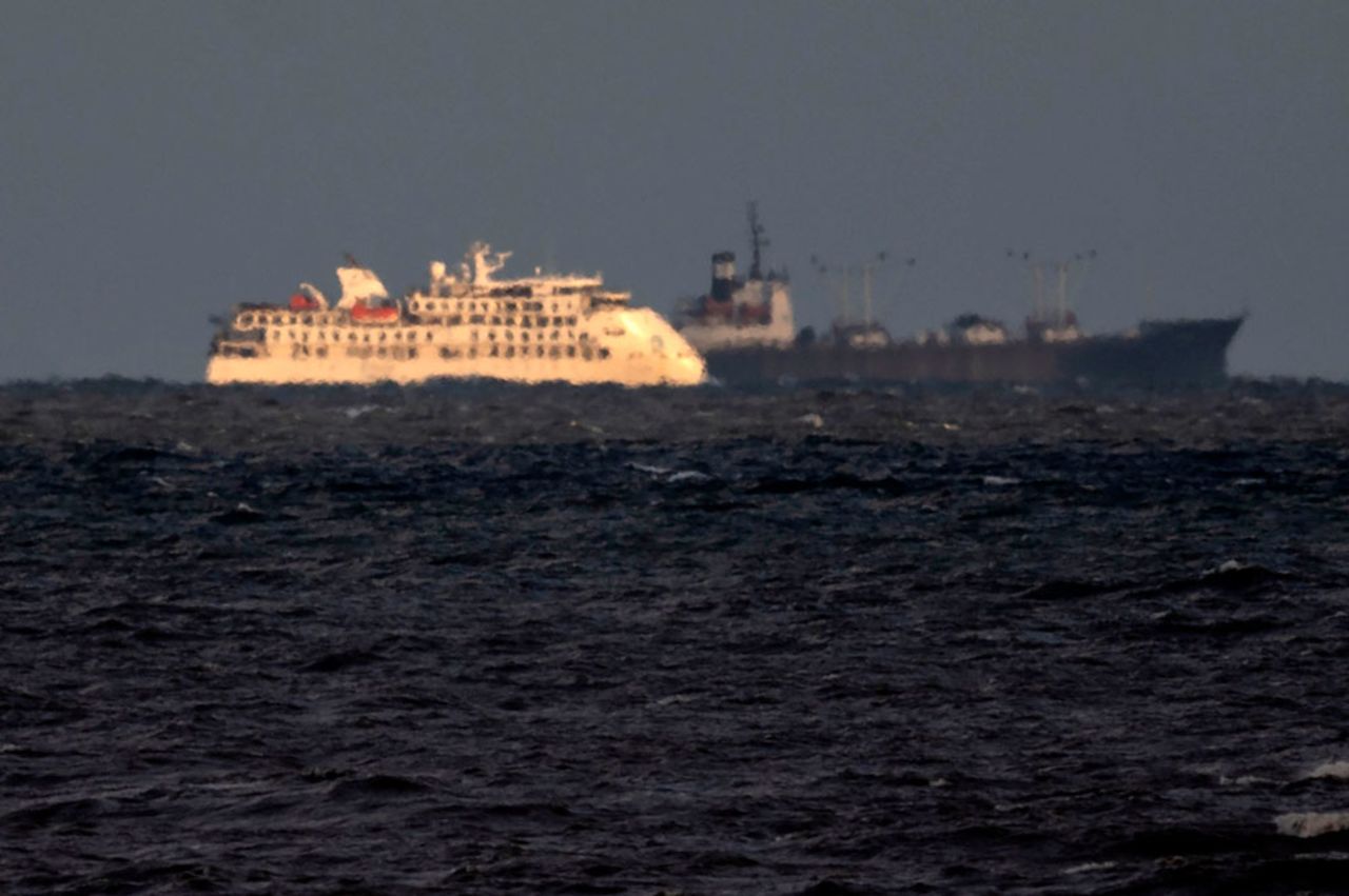 View of Australian cruise ship Greg Mortimer and a ship of the Uruguayan Navy off the port of Montevideo on April 6.