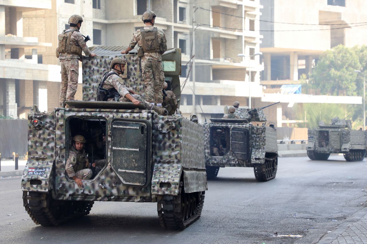 Lebanese soldiers patrol a street after the gunfire erupted.