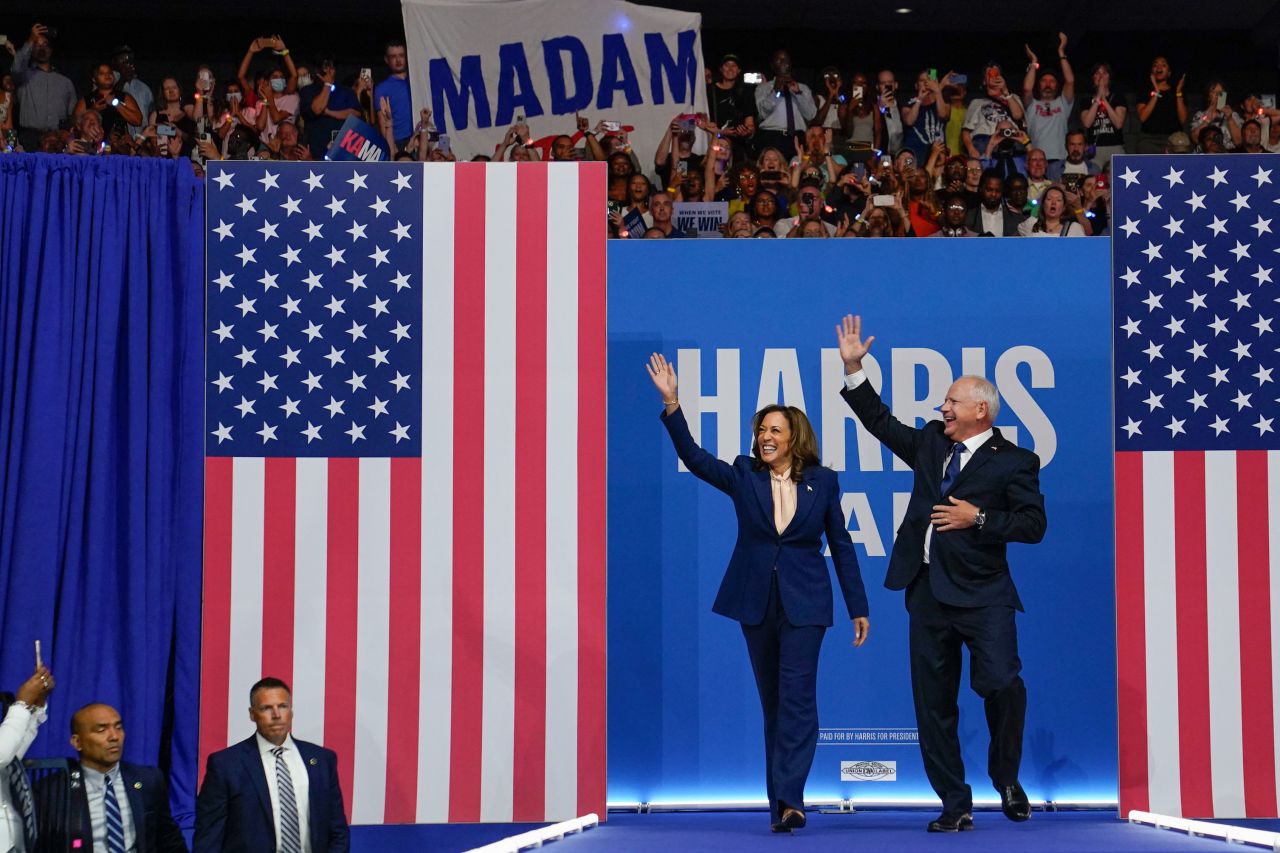 Vice President and Democratic presidential candidate Kamala Harris takes the stage with her newly chosen vice presidential running mate Minnesota Governor Tim Walz during a campaign rally in Philadelphia on Tuesday, August 6.