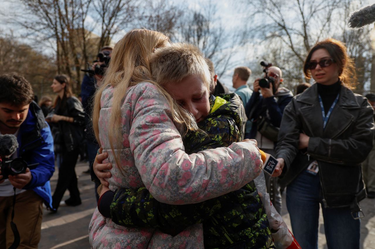 Iryna embraces her son Bogdan after being reunited in Kyiv on April 8.