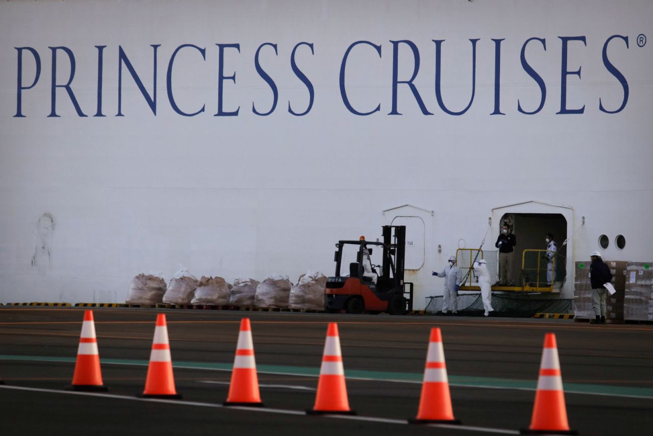 Workers load supplies onto the quarantined Diamond Princess cruise ship Thursday, February 13, in Yokohama, Japan.