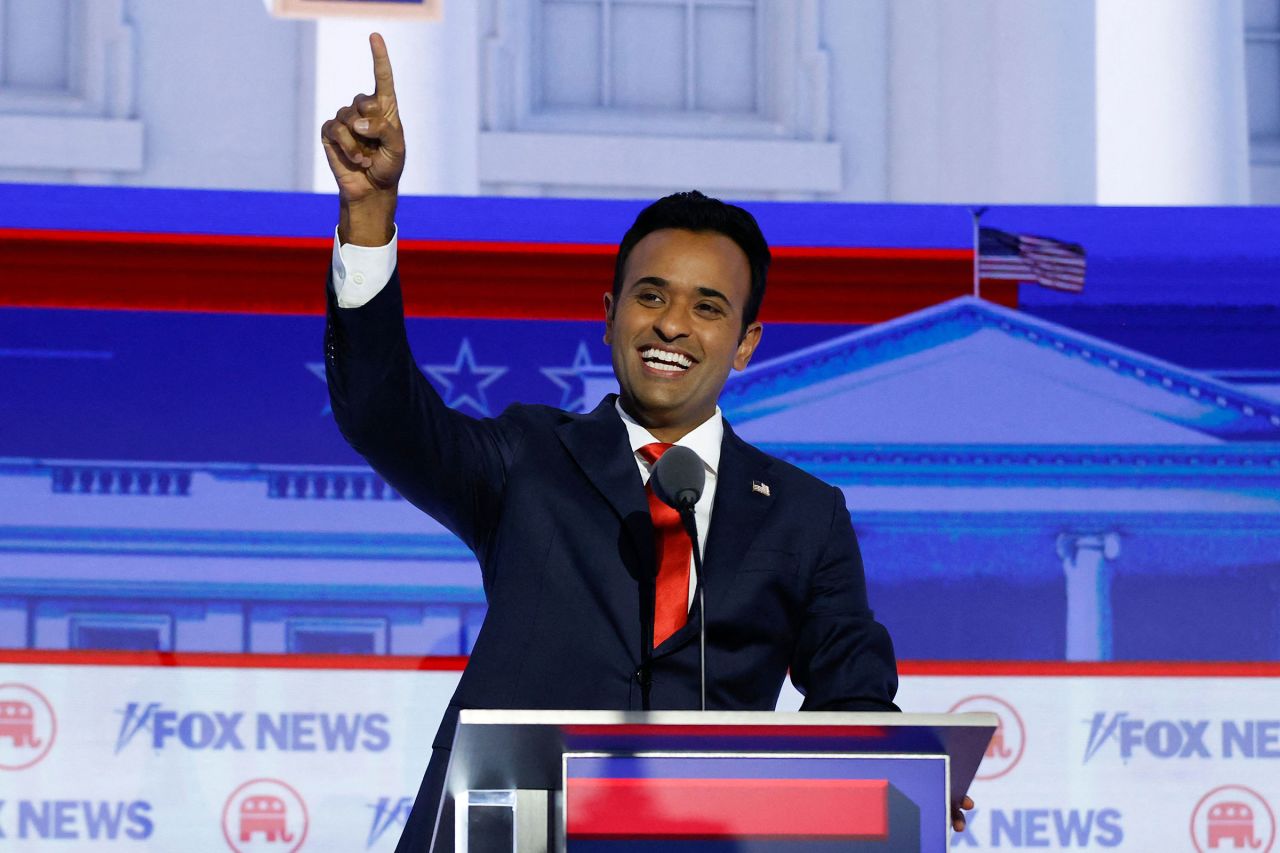 Entrepreneur and author Vivek Ramaswamy waves as he arrives to take part in the first Republican Presidential primary debate in Milwaukee on Wednesday.