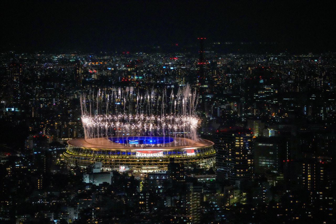 Fireworks explode over Tokyo's National Stadium during the Olympics' closing ceremony on August 8, 2021.