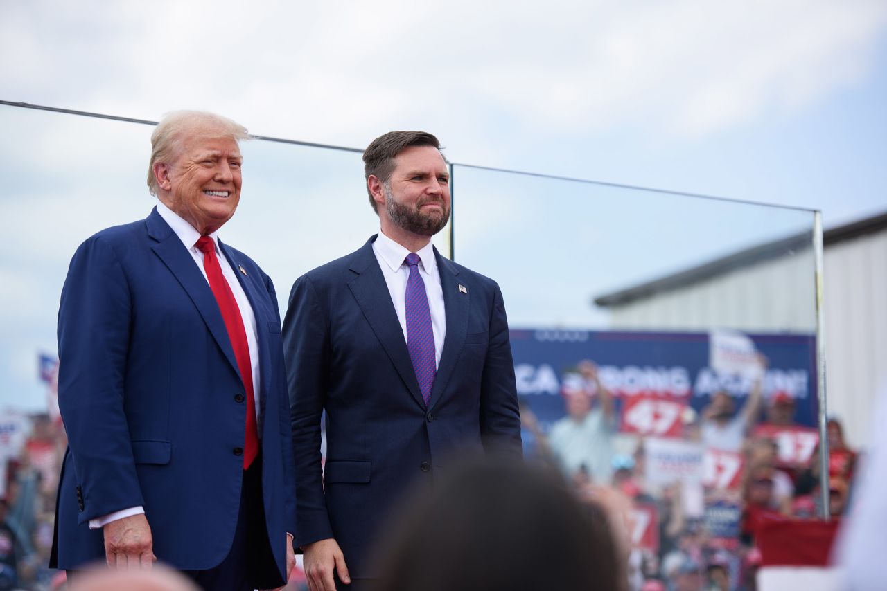 Republican presidential candidate, former President Donald Trump, left, poses for photos with Republican vice presidential candidate, Sen. JD Vance ahead of a rally in Asheboro, North Carolina, on August 21. 