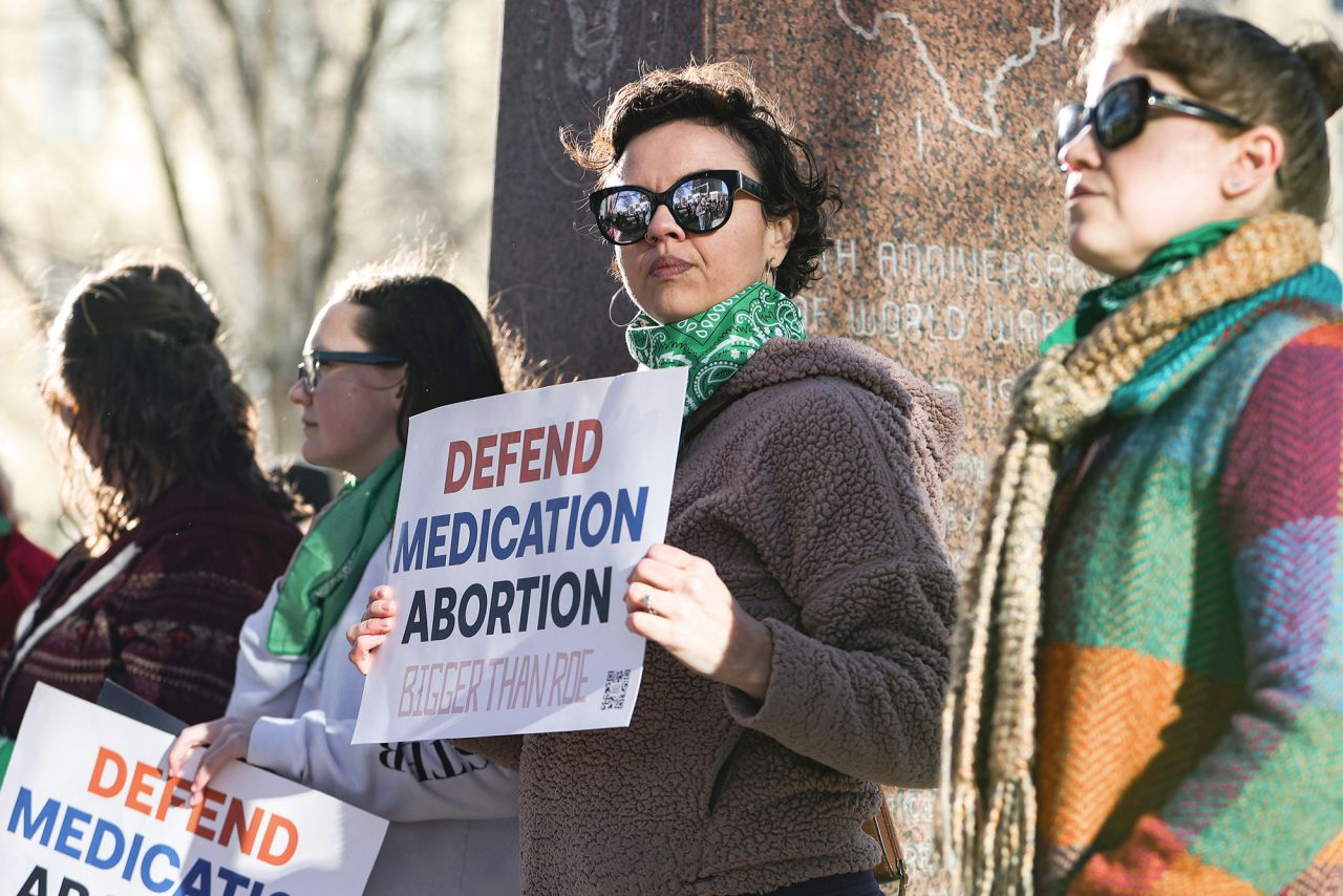 Lindsay London holds protest sign in front of federal court building in support of access to abortion medication outside the Federal Courthouse on Wednesday, March 15 in Amarillo, Texas.