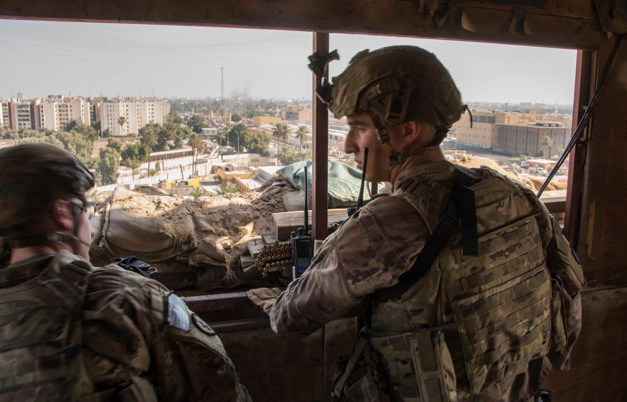 US soldiers provide armed overwatch at the US Embassy compound in Baghdad on January 1.