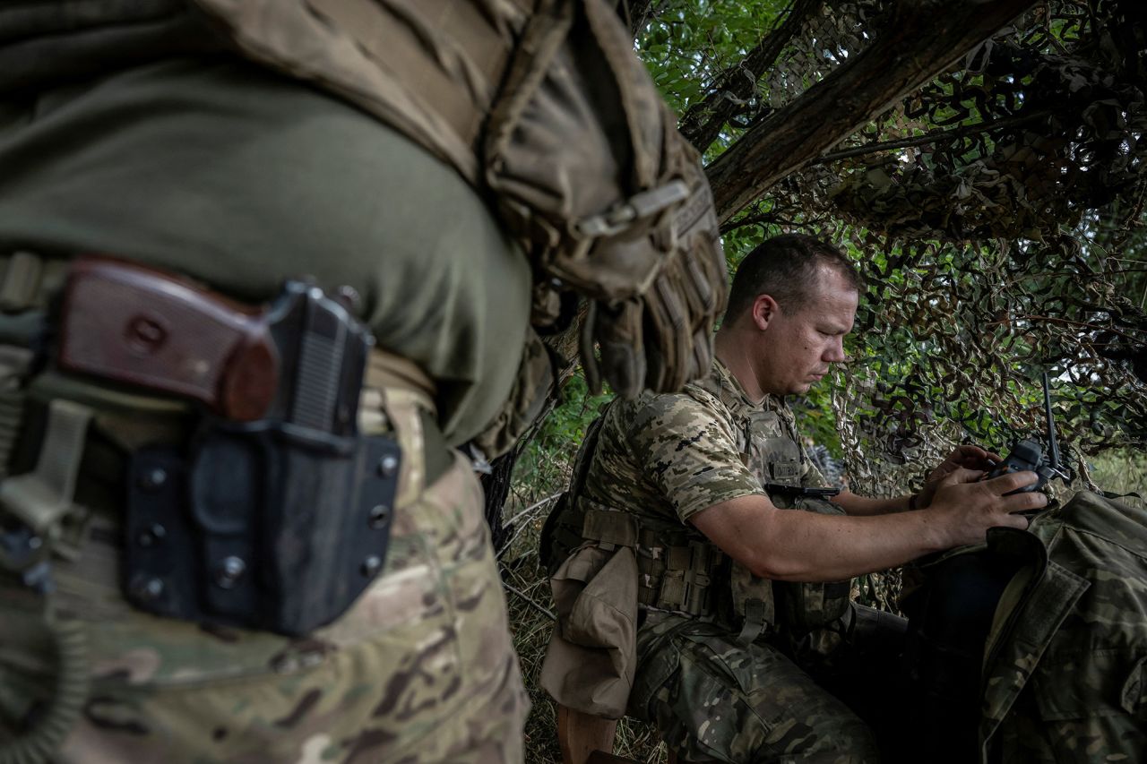 A Ukrainian serviceman operates an FPV drone from his positions at a front line near the village of Robotyne, Zaporizhzhia region, Ukraine, on August 25.