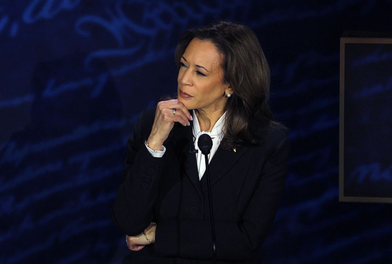 Vice President Kamala Harris listens to former President Donald Trump during the debate.