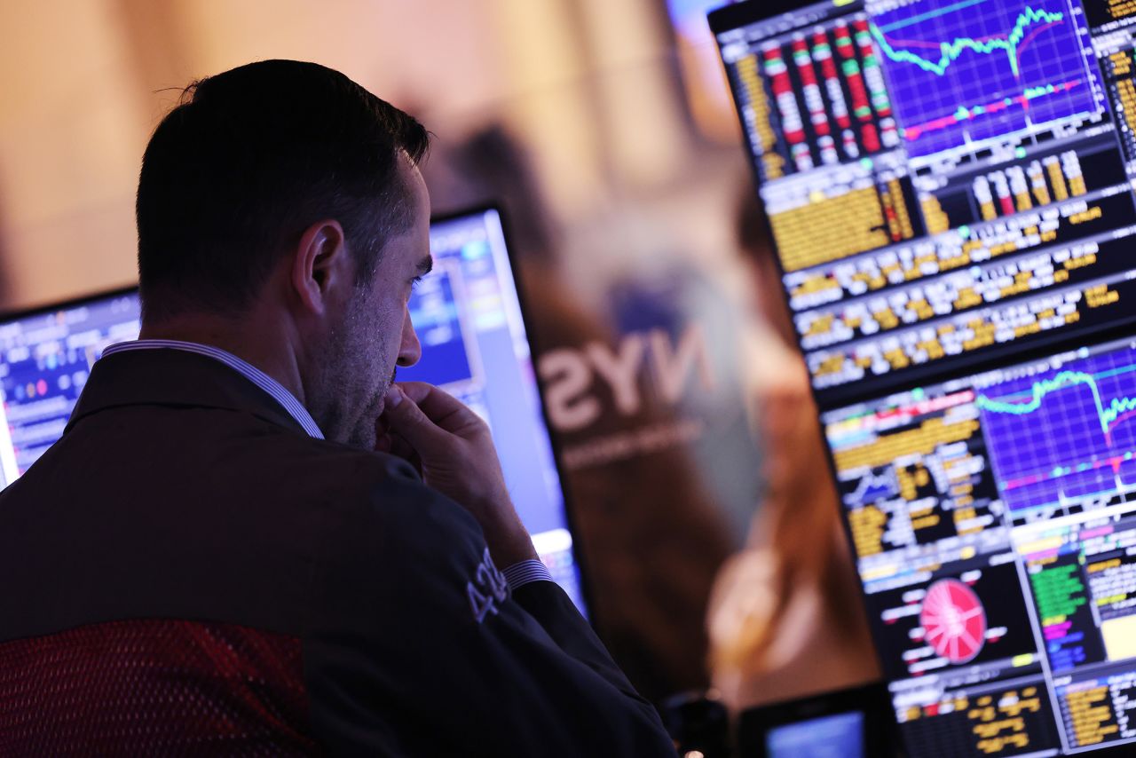 Traders work on the floor of the New York Stock Exchange during afternoon trading on August 5.