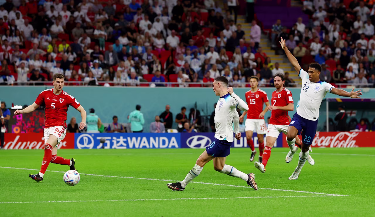 England's Phil Foden scores his country's second goal against Wales.