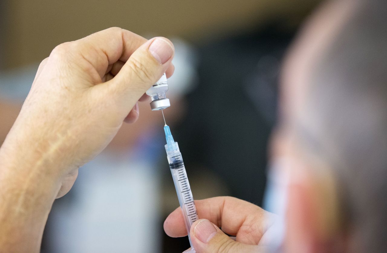 A healthcare worker prepares the Pfizer/BioNTech Covid-19 vaccine for shelter residents in Montreal on January 25.