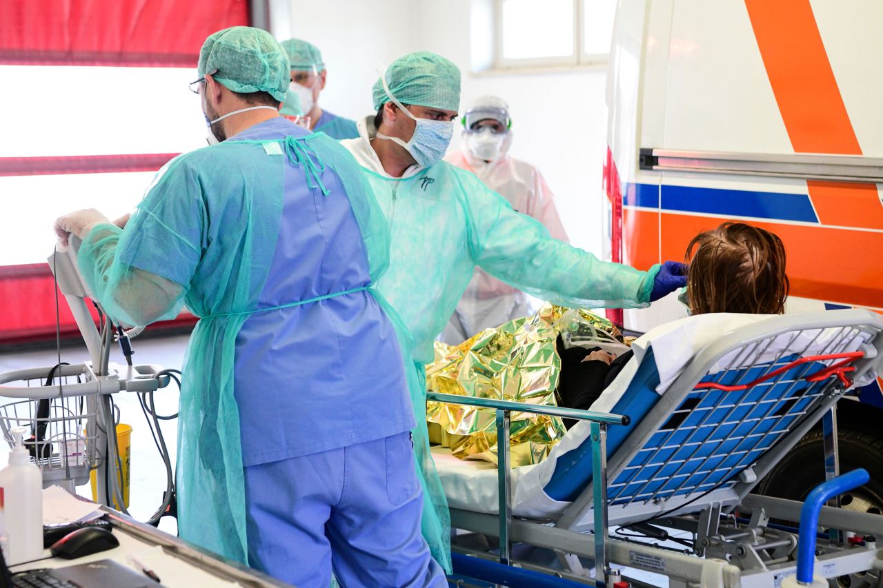 A medical worker tends to a patient arriving on a stretcher at the new coronavirus intensive care unit of the Brescia Poliambulanza hospital, in Lombardy, Italy on March 17.