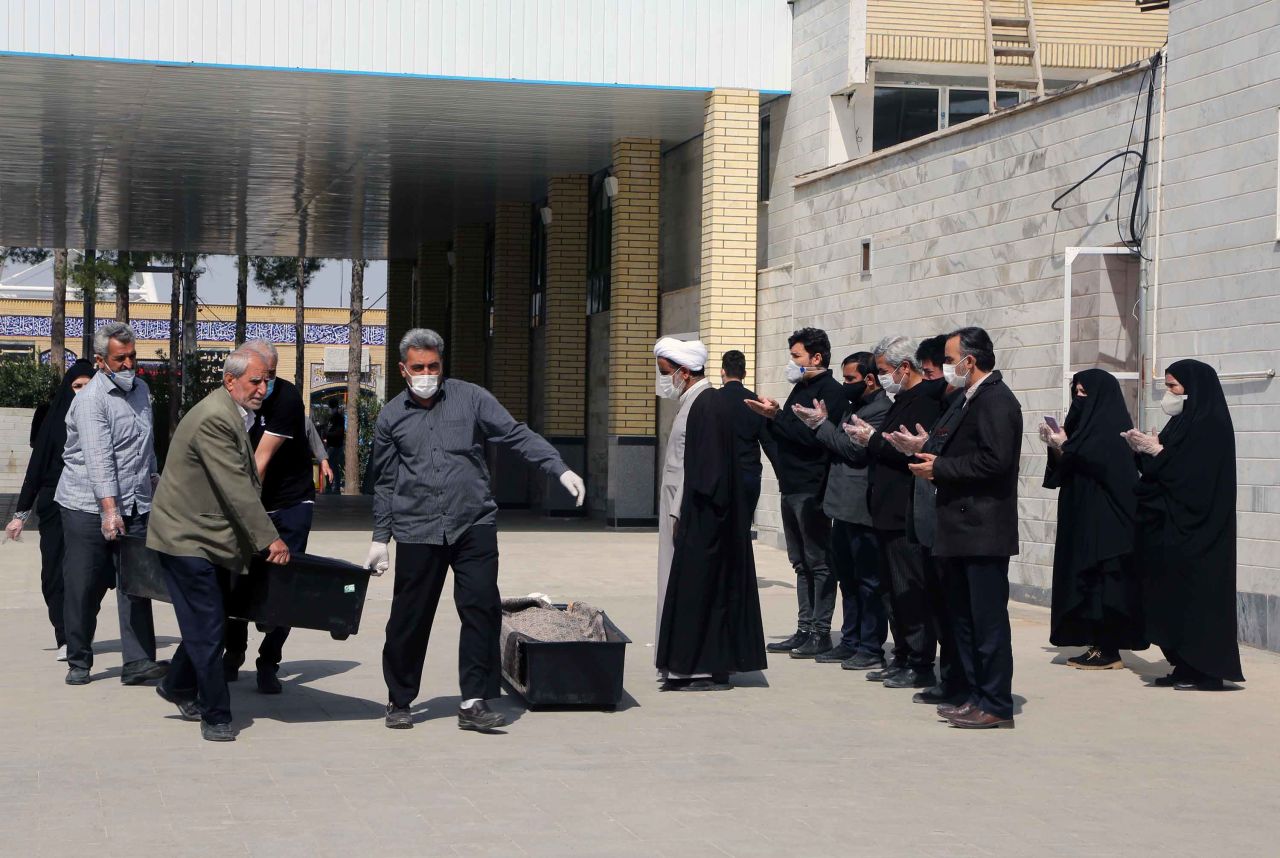 Funeral prayers are performed at Beheshte Masoumeh Cemetery for victims of the coronavirus outbreak in Qom, Iran on March 17.