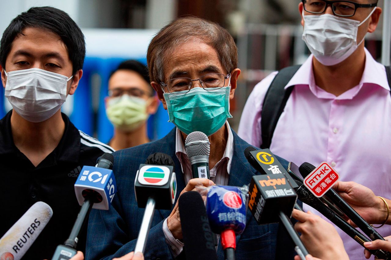 Former lawmaker and pro-democracy activist Martin Lee talks to members of the media as he leaves the Central District police station in Hong Kong on April 18.