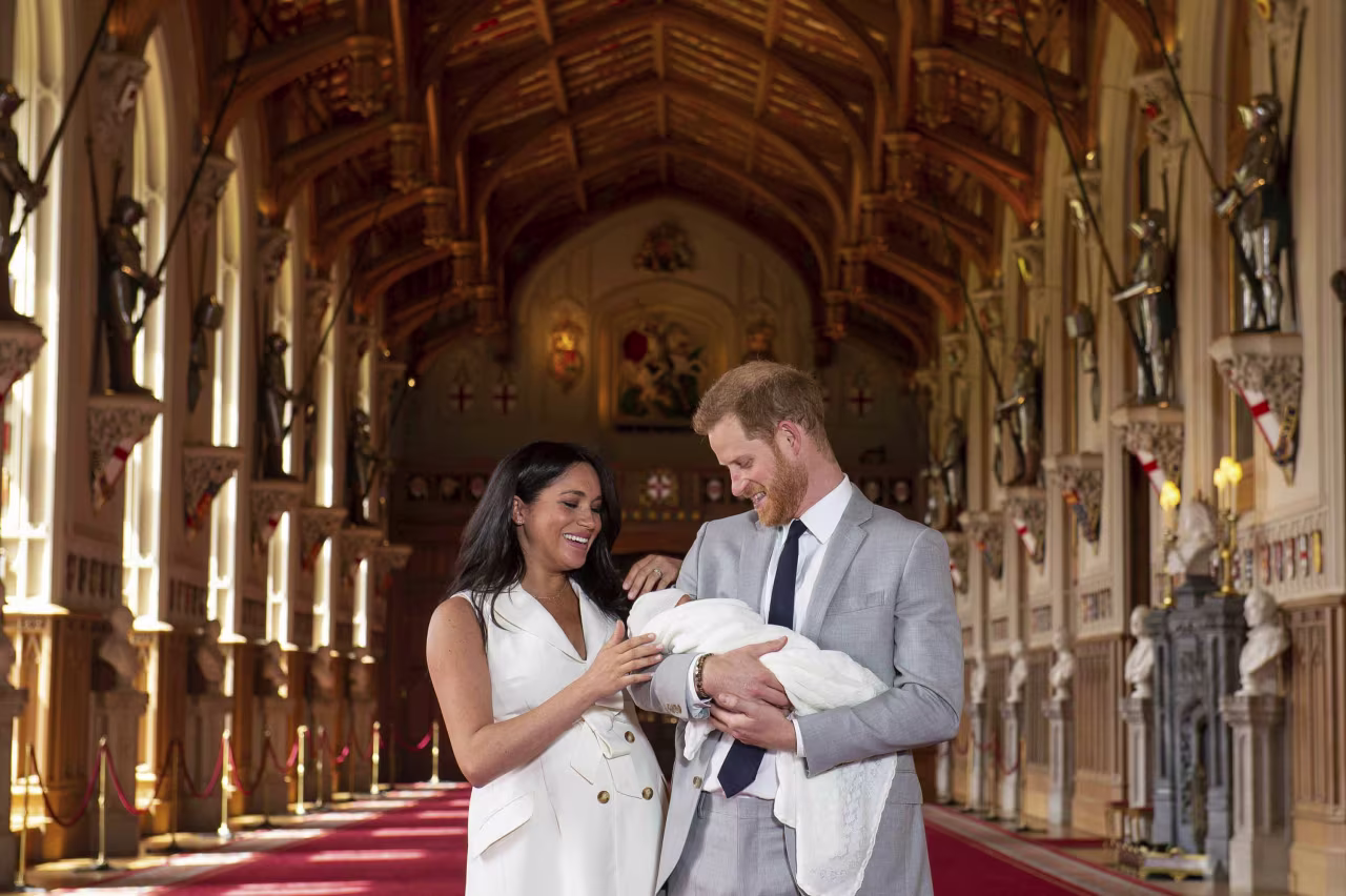 Britain's Prince Harry and Meghan, Duchess of Sussex, during a photocall with their newborn son, in St George's Hall at Windsor Castle, Windsor.