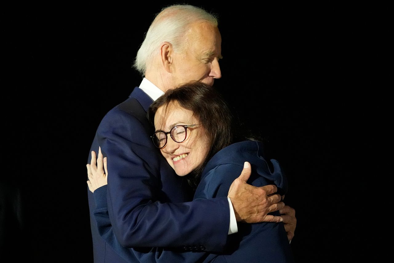 President Joe Biden hugs Alsu Kurmasheva at Joint Base Andrews following her release on Thursday.