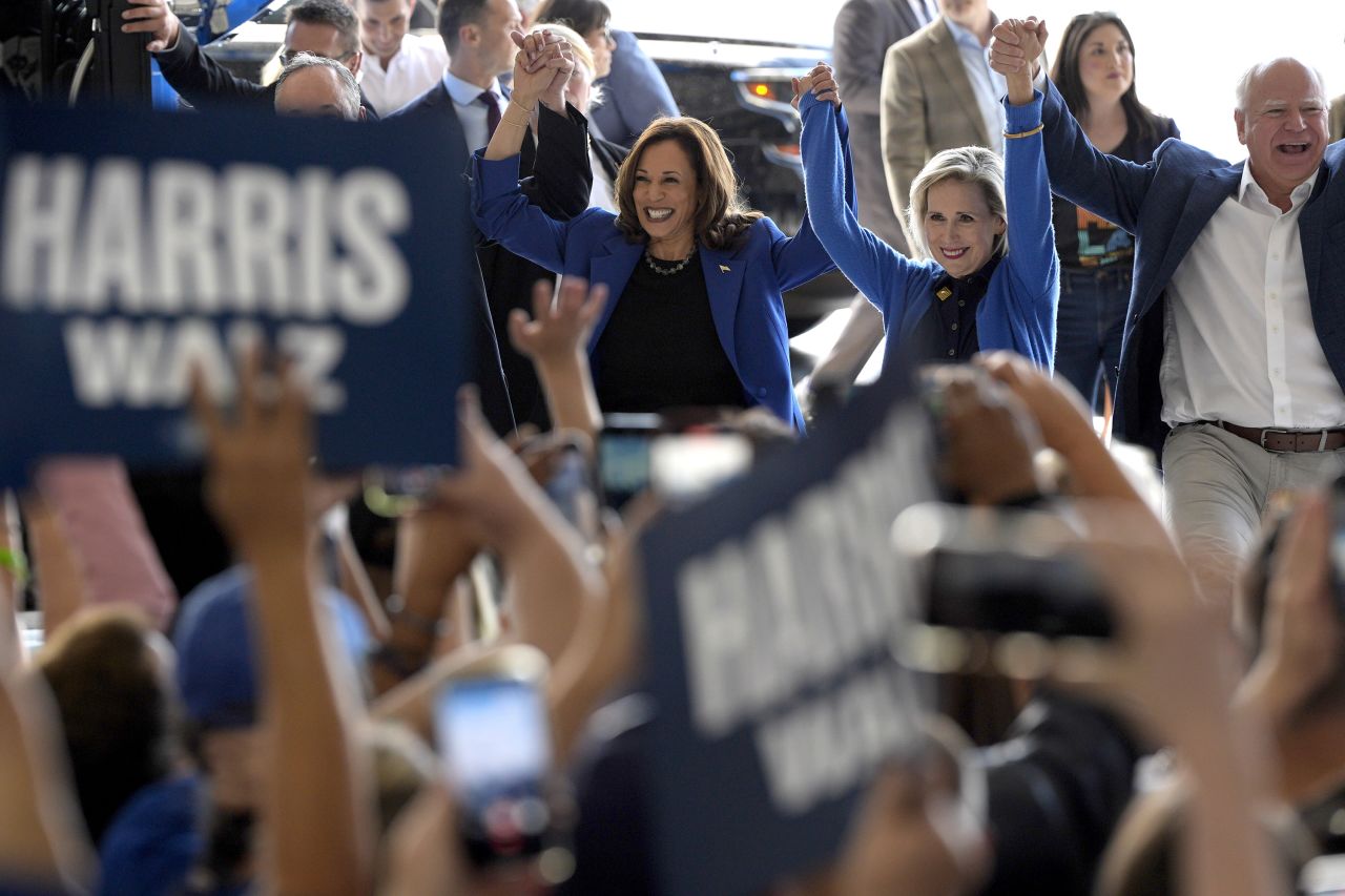 Vice President Kamala Harris and Minnesota Gov. Tim Walz, with his wife Gwen Walz, greet supporters as they arrive in Pittsburgh on August 18.