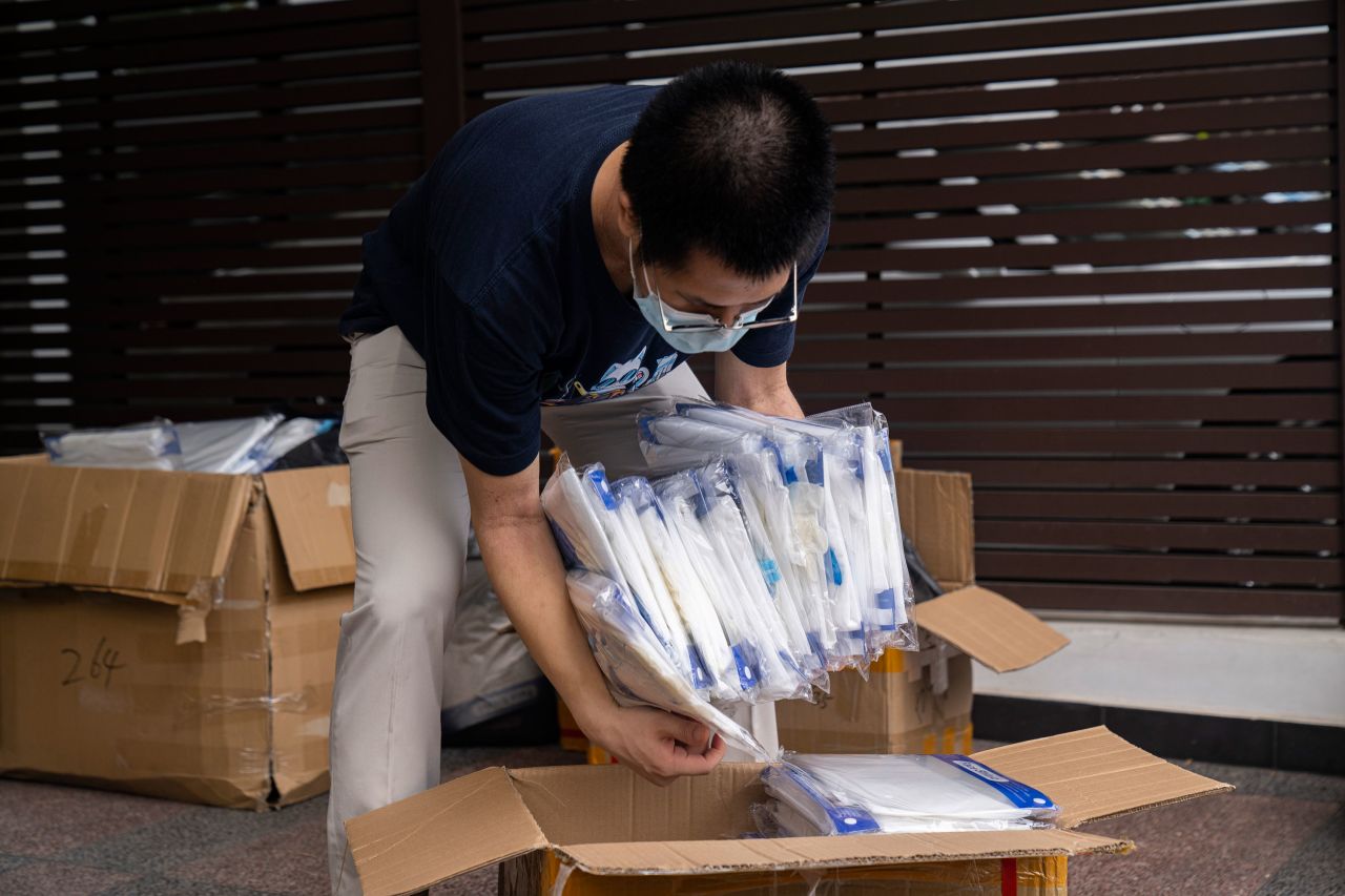 A volunteer packs personal protective equipment to be distributed to migrant workers on May 23 in Singapore.