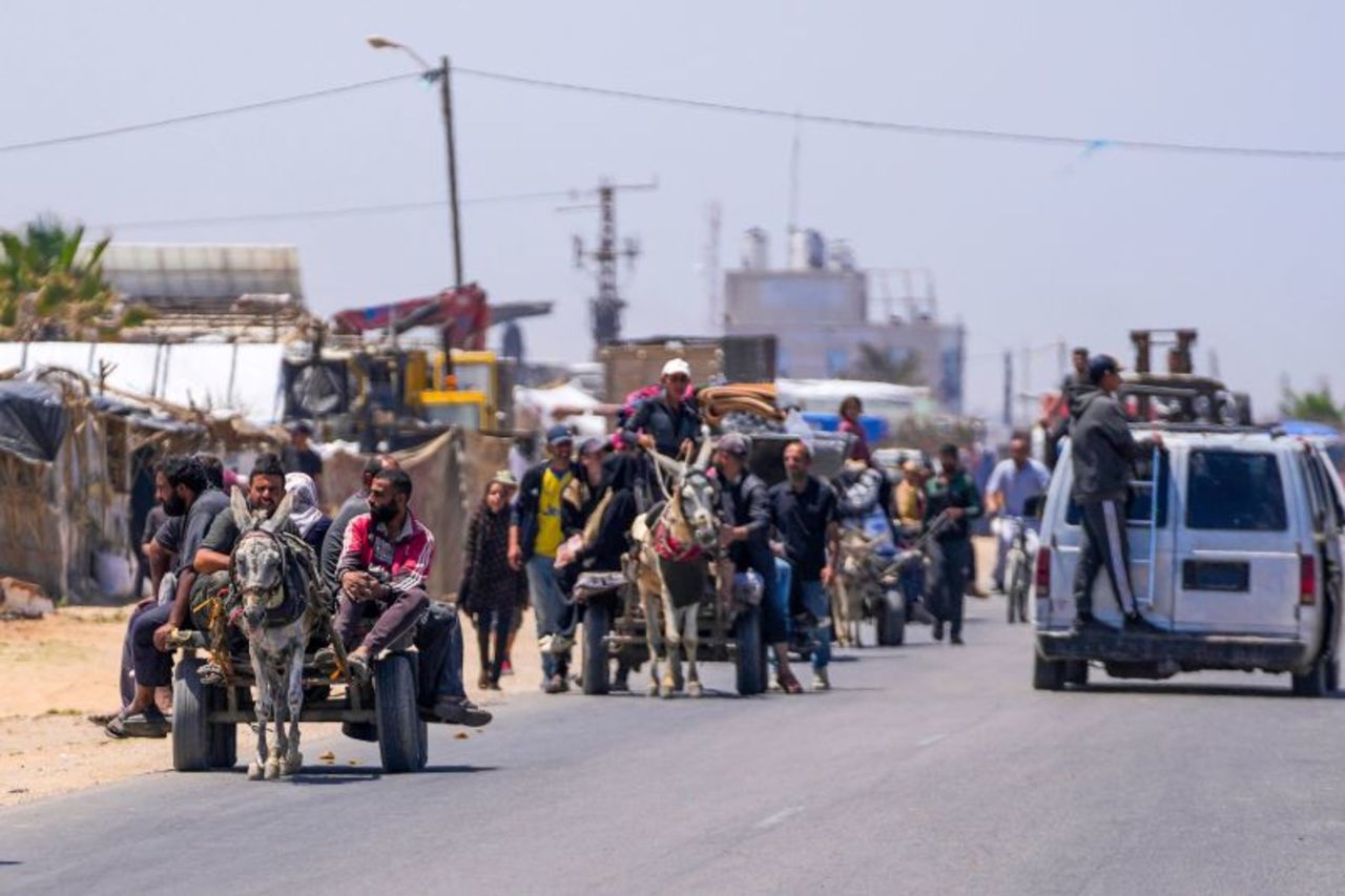 Displaced Palestinians arrive in Deir al Balah, Gaza, after fleeing from Rafah, Gaza, on May 9. 