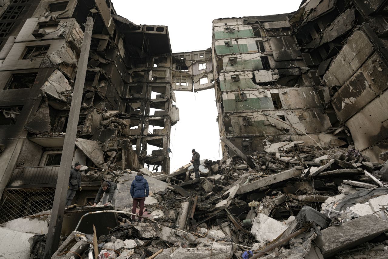 Residents look for belongings in the ruins of an apartment building destroyed during fighting between Ukrainian and Russian forces in Borodianka, Ukraine, on April 5. 