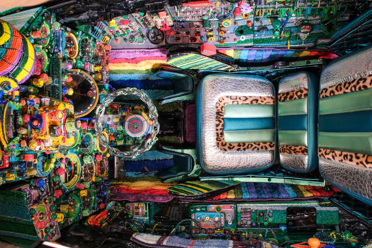 The cockpit of the MiG-21 installation was a crossover of pan-African beadwork and an inspiration much closer to Ziman’s current home: Los Angeles lowrider culture. The team removed the jet’s joystick and fitted a steering wheel, and added a faux-leopard and crocodile skin seat.