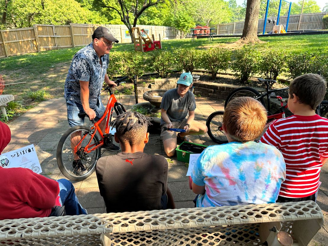 At a Newhouse KC summer camp, volunteers teach children how to ride and maintain bikes. Newhouse KC accepts men, women, children and pets, according to Endres, a special consultant to the shelter.