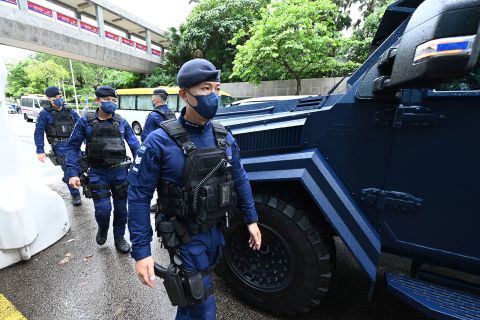 A special unit of the Hong Kong police provides security in the city's Wan Chai district on June 30.