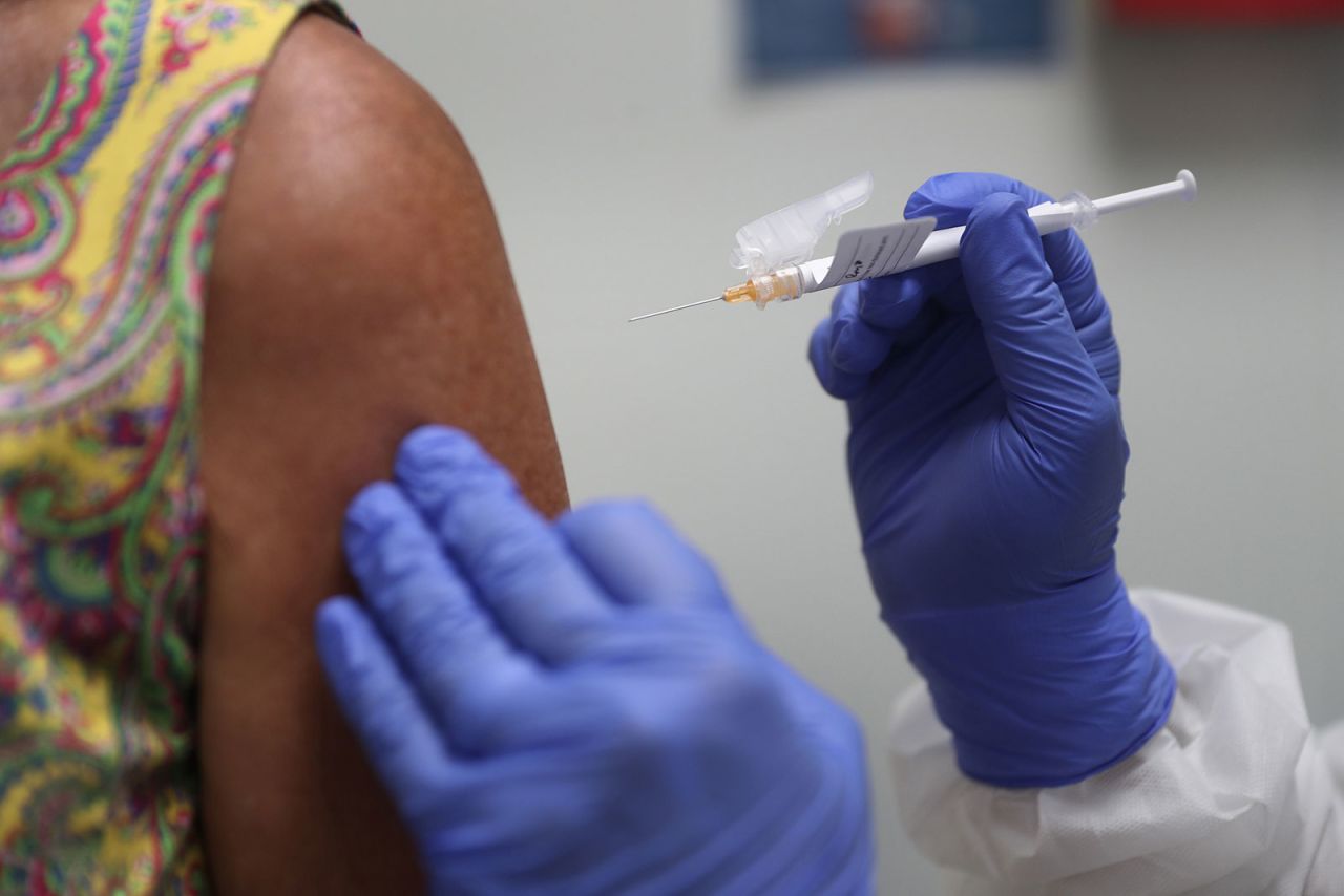 A participant receives a Covid-19 vaccination as she takes part in a vaccine study at Research Centers of America on August 7 in Hollywood, Florida.?