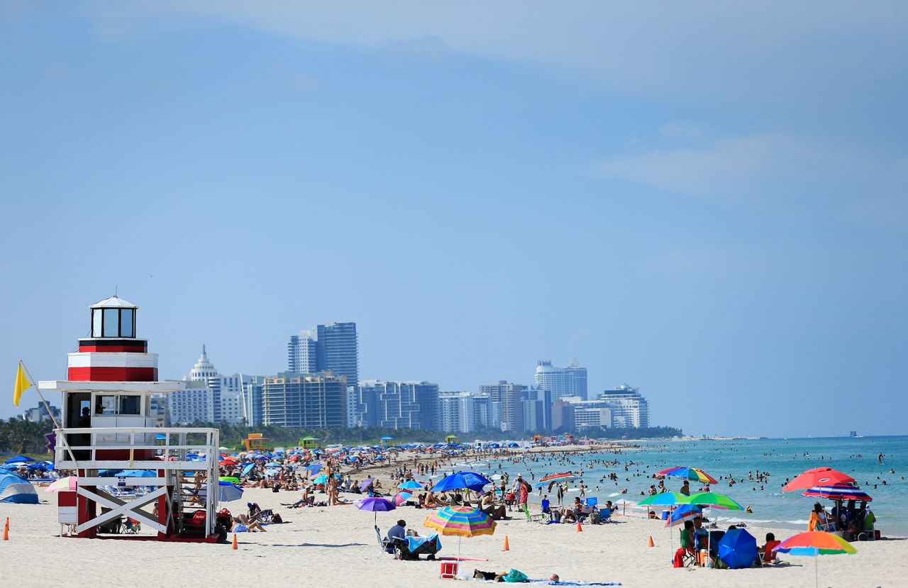 Beachgoers on South Beach on June 10, 2020 in Miami Beach, Florida as the area eased restrictions put in place to contain COVID-19. 