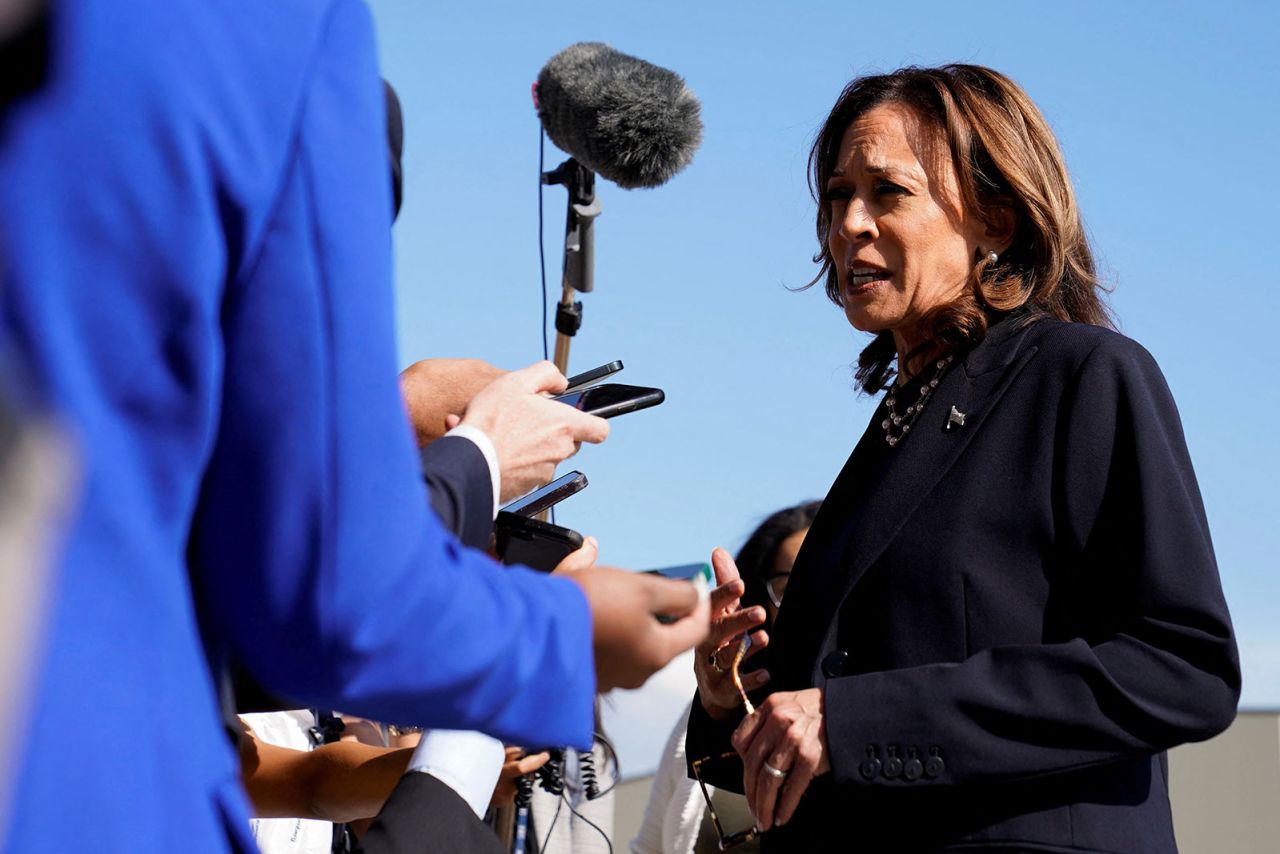 Vice President and Democratic presidential candidate Kamala Harris speaks with members of the media before boarding Air Force Two at Detroit Metropolitan Wayne County Airport in Romulus, Michigan, on Thursday, August 7.