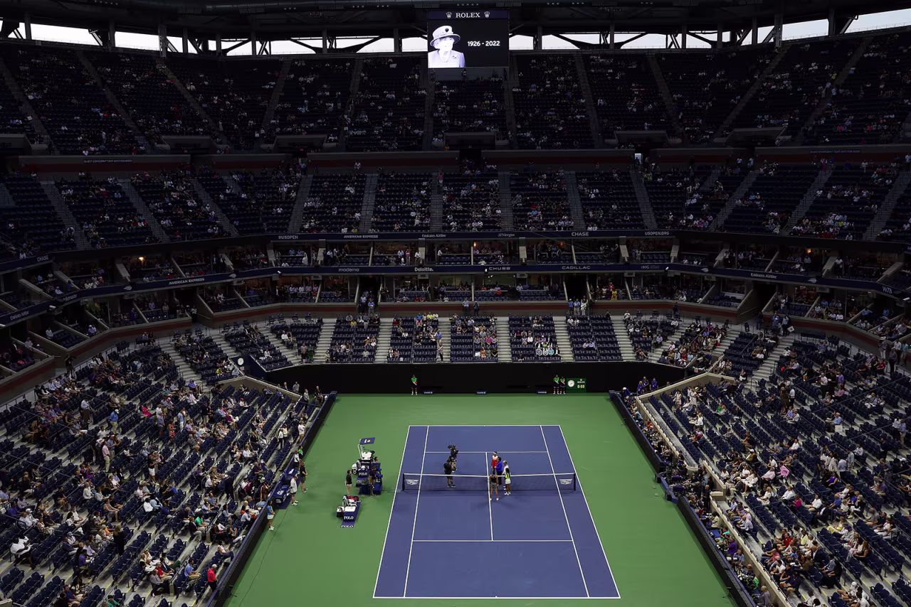 Ons Jabeur of Tunisia and Caroline Garcia of France stand on court for a moment of silence for Queen Elizabeth prior to their Women’s Singles Semifinal match of the 2022 US Open in New York on September 08, 2022.