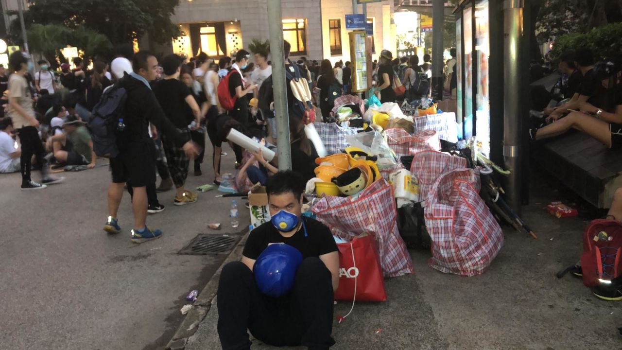 Protesters sit with supplies.