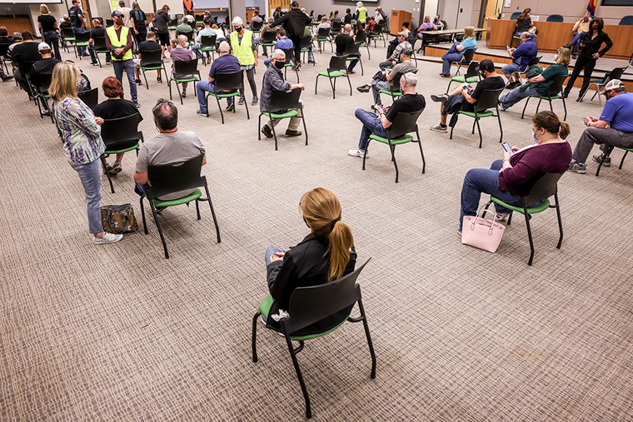 Patients sit in an observation area for 15 minutes after receiving a dose of the Johnson & Johnson COVID-19 vaccine at an event put on by the Thornton Fire Department on March 6, 2021 in Thornton, Colorado. 