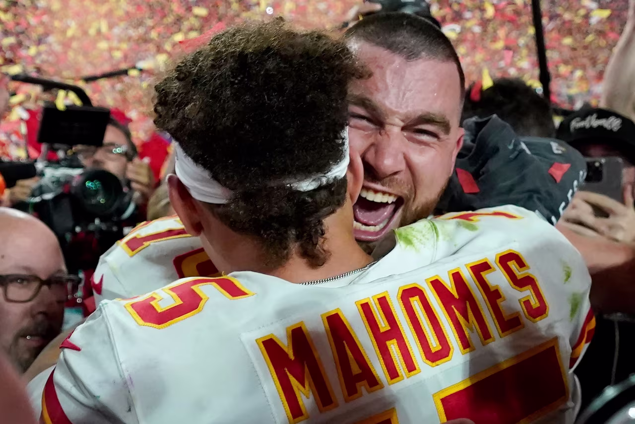 Kansas City Chiefs tight end Travis Kelce celebrates with Mahomes.