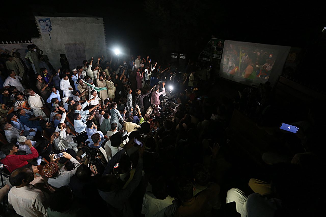 Family members and supporters of Pakistani athlete Arshad Nadeem watch the Olympic men's javelin throw final on a screen in Khanewal District in Pakistan, on August 9. 