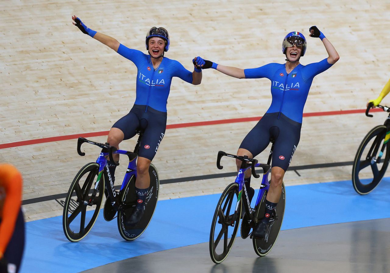 Italy’s Chiara Consonni and Vittoria Guazzini celebrate after winning gold in the women’s Madison on Friday, August 9. 