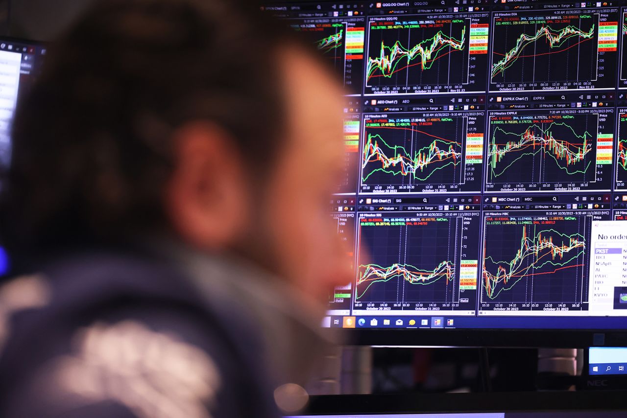 Traders work on the floor of the New York Stock Exchange during morning trading today.