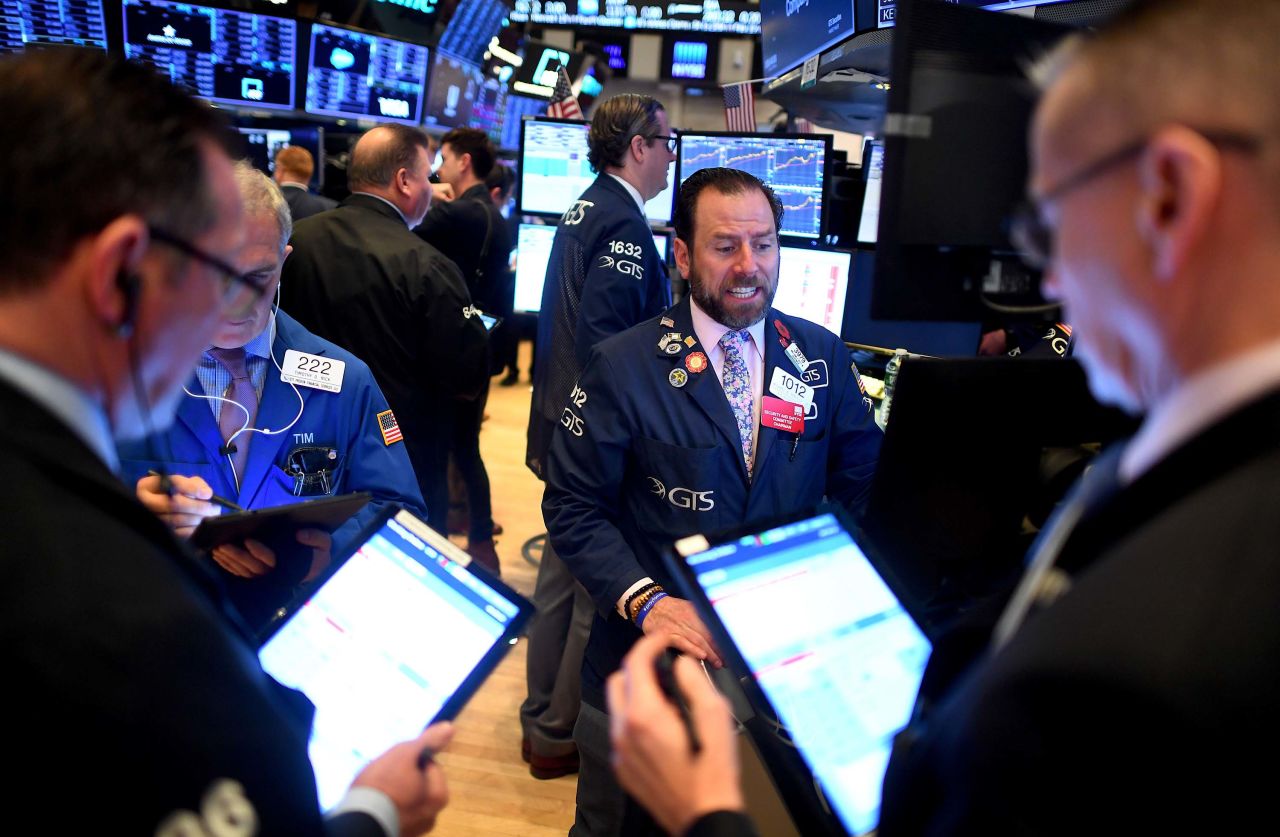 Traders work during the opening bell at the New York Stock Exchange on Thursday.