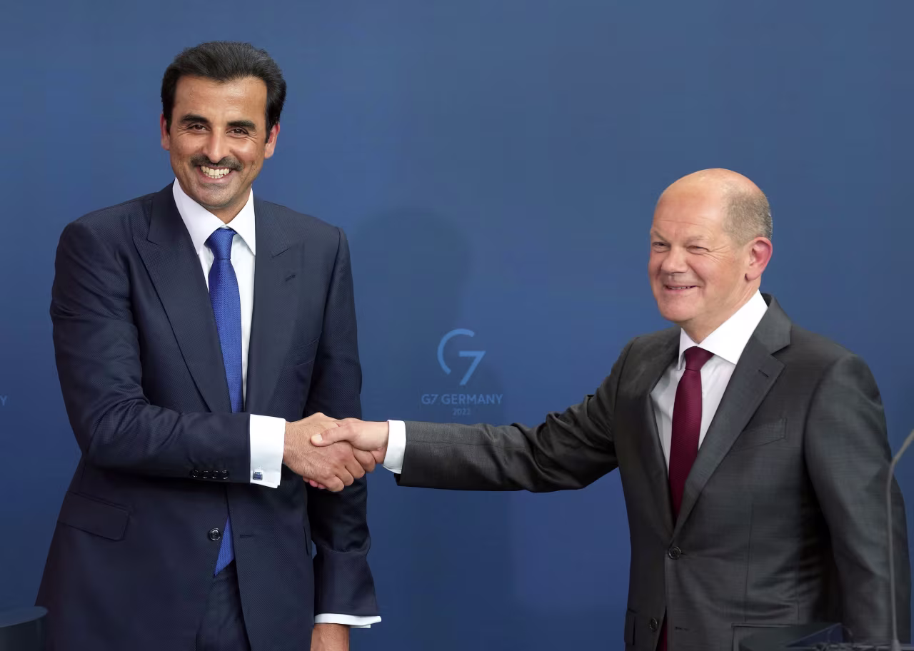 The Emir of Qatar Sheikh Tamim bin Hamad Al Thani and German Chancellor Olaf Scholz shake hands after a joint press conference in Berlin on Friday.