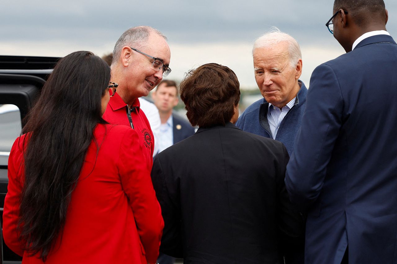 U.S. President Joe Biden is greeted by Shawn Fain, President of the United Auto Workers (UAW), Rep. Shri Thanedar (MI-13), Lieutenant Governor Garlin Gilchrist, Rep. Debbie Dingell (MI-06) and Rep. Rashida Tlaib (MI-12) as he arrives at Detroit Metropolitan Wayne County Airport in Romulus, Michigan, today.